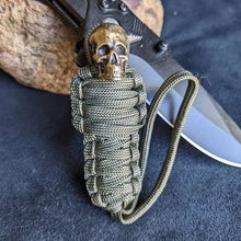 Load image into Gallery viewer, Paracord Keychain Mummy Brass Skull