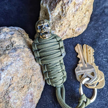 Load image into Gallery viewer, Paracord Keychain Mummy Brass Skull